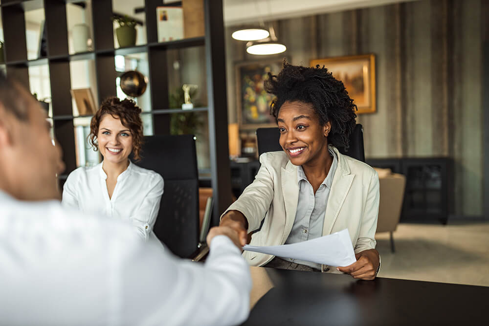 Salespeople meeting and having a conversation
